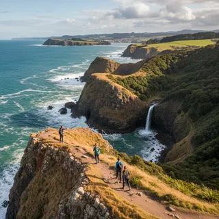 Coastal walking track with rugged cliffs and ocean views in Dunedin.