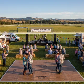 Wingatui racecourse set up for the Silverpeaks Country Music Festival with a large crowd enjoying the outdoor event.